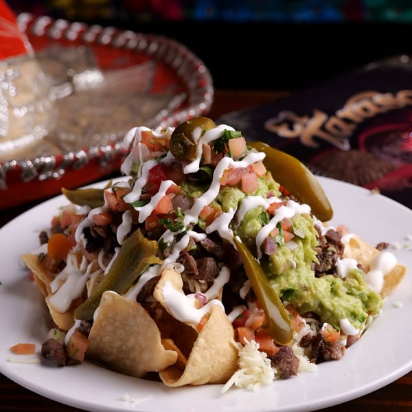 El Tarasco Mexican Restaurant's nachos with steak, guacamole, pico de gallo, sour cream, and pickled jalapeños.